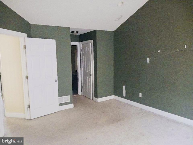 unfurnished bedroom featuring baseboards and carpet flooring