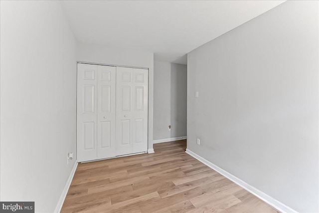 100 Cypress Dr, North East, MD 21901 - unfurnished bedroom featuring light wood finished floors, baseboards, and a closet