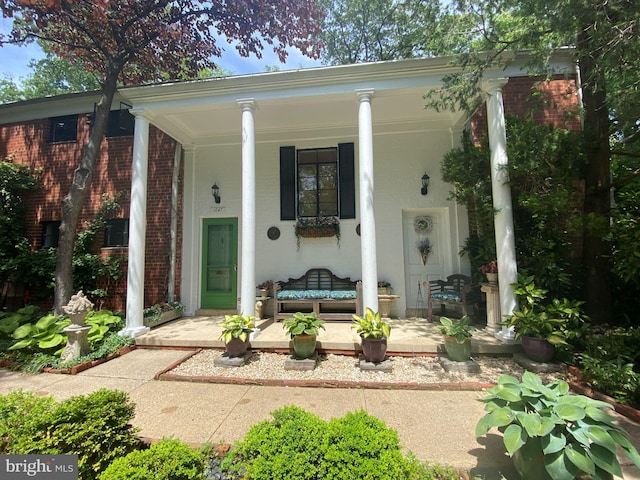 1647 Preston Rd, Alexandria, VA 22302 - doorway to property featuring a porch and brick siding