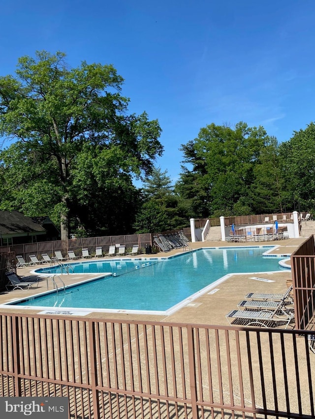 1647 Preston Rd, Alexandria, VA 22302 - community pool with a patio area and view of wooded area