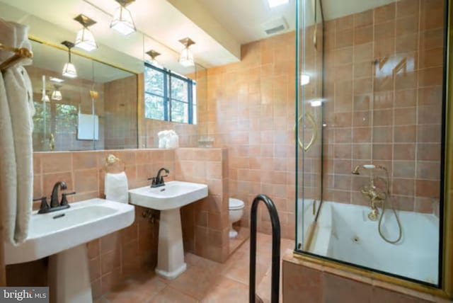 1647 Preston Rd, Alexandria, VA 22302 - full bath featuring tile walls, tile patterned floors, toilet, and tasteful backsplash