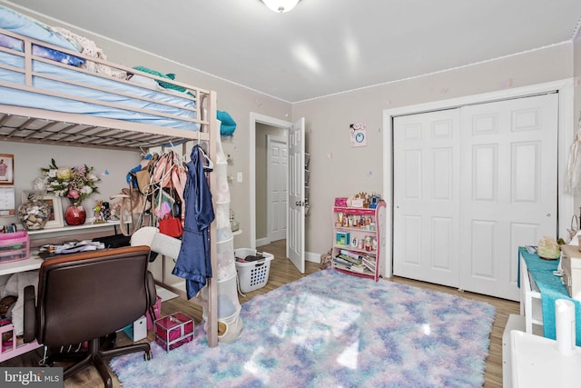 12 Bloomfield Ln, Willingboro, NJ 08046 - bedroom featuring a closet, wood finished floors, and a desk
