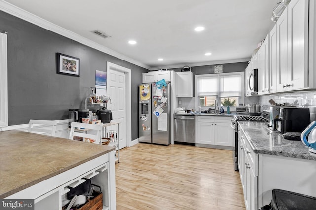 12 Bloomfield Ln, Willingboro, NJ 08046 - kitchen featuring stainless steel appliances, ornamental molding, white cabinetry, light wood-type flooring, and recessed lighting