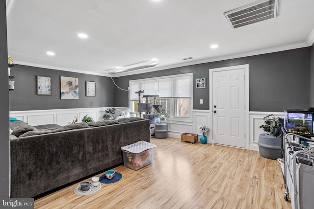 12 Bloomfield Ln, Willingboro, NJ 08046 - living area with crown molding, a wainscoted wall, wood finished floors, recessed lighting, and a decorative wall