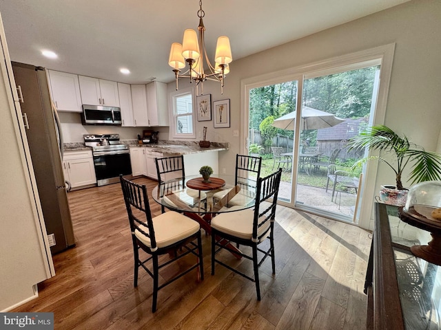 1410 Foxwood Ct, Annapolis, MD 21409 - dining room featuring wood finished floors, a chandelier, and recessed lighting