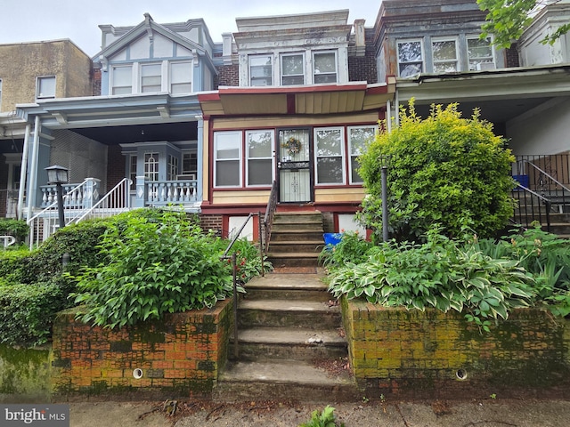 5718 Pentridge St, Philadelphia, PA 19143 - view of front of house featuring stairway and brick siding