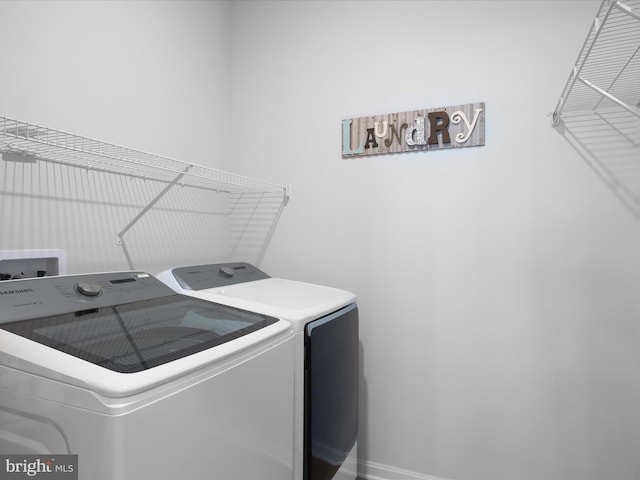 832 Red Maple Rd, Smyrna, DE 19977 - laundry area featuring separate washer and dryer and baseboards