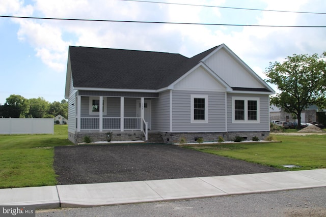 1296 Dorchester Ave, Pocomoke City, MD 21851 - view of front of house featuring covered porch, roof with shingles, asphalt driveway, and crawl space