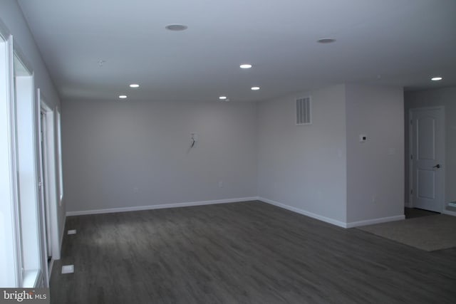 1296 Dorchester Ave, Pocomoke City, MD 21851 - empty room with dark wood-style floors, recessed lighting, and baseboards