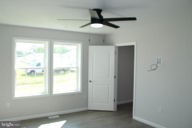 1296 Dorchester Ave, Pocomoke City, MD 21851 - unfurnished bedroom featuring baseboards, wood finished floors, and a ceiling fan
