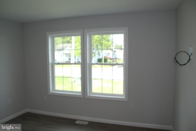 1296 Dorchester Ave, Pocomoke City, MD 21851 - unfurnished room featuring baseboards and dark wood-style flooring