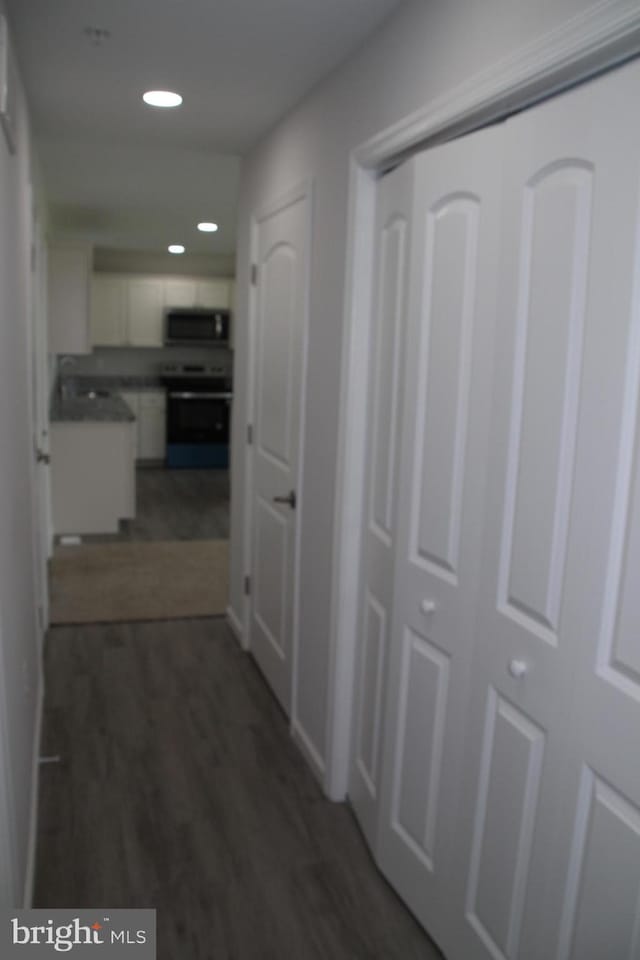 1296 Dorchester Ave, Pocomoke City, MD 21851 - hall with dark wood-style flooring and recessed lighting