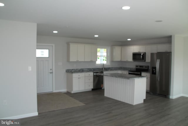 1296 Dorchester Ave, Pocomoke City, MD 21851 - kitchen featuring appliances with stainless steel finishes, recessed lighting, baseboards, a kitchen island, and white cabinetry
