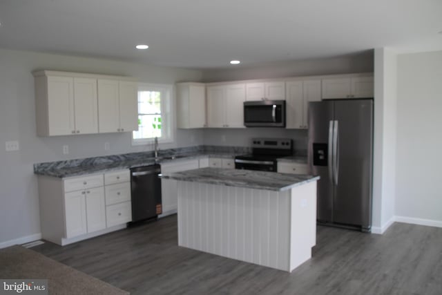 1296 Dorchester Ave, Pocomoke City, MD 21851 - kitchen with appliances with stainless steel finishes, white cabinetry, dark wood-style flooring, baseboards, and recessed lighting