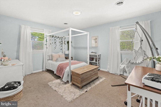 carpeted bedroom with baseboards