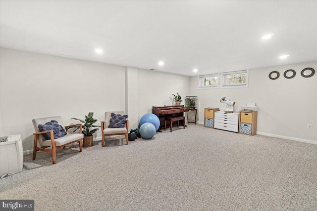 living area featuring recessed lighting, baseboards, and carpet