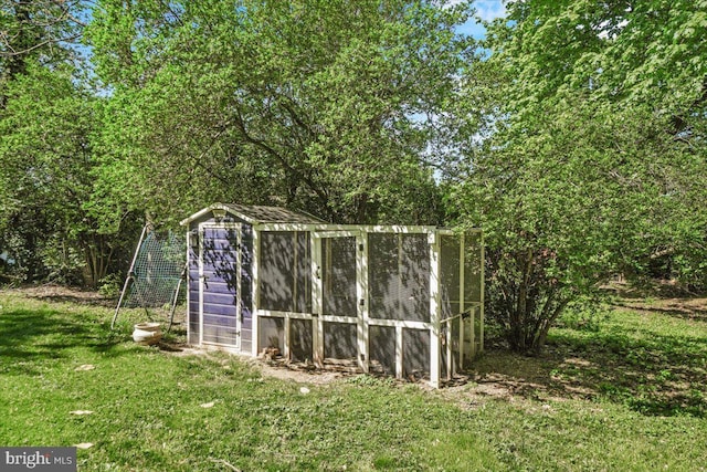 view of poultry coop with a yard