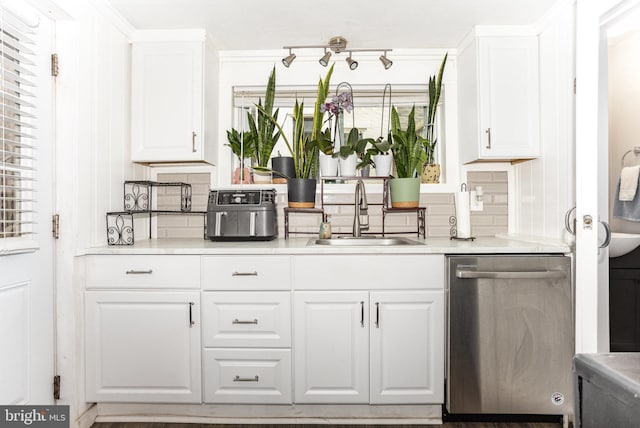 519 N 2nd St, Columbia, PA 17512 - kitchen featuring dishwasher, a sink, white cabinetry, and light countertops