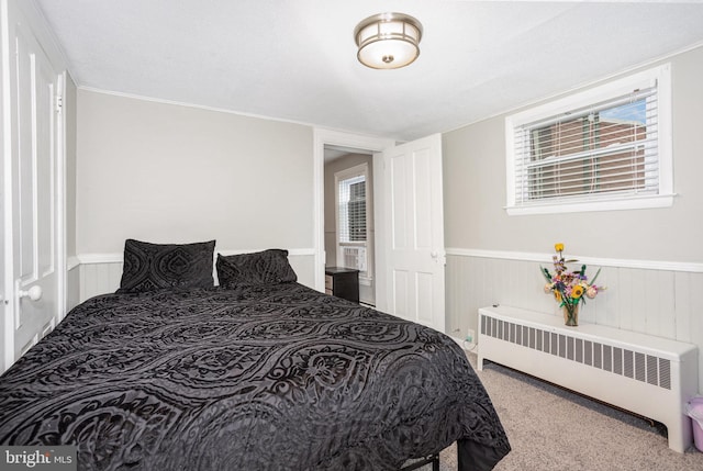519 N 2nd St, Columbia, PA 17512 - carpeted bedroom featuring radiator and a wainscoted wall