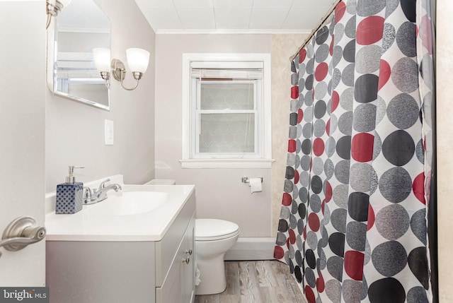 519 N 2nd St, Columbia, PA 17512 - bathroom with ornamental molding, wood finished floors, toilet, vanity, and a shower with curtain