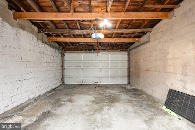 519 N 2nd St, Columbia, PA 17512 - garage with concrete block wall and a garage door opener