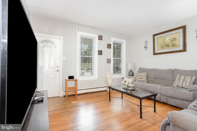519 N 2nd St, Columbia, PA 17512 - living room featuring a baseboard heating unit and light wood-type flooring