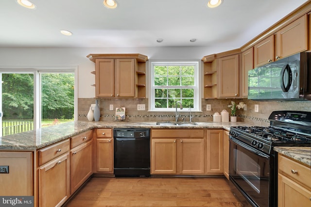 5513 Notched Beak Ct, Waldorf, MD 20601 - kitchen with black appliances, open shelves, a peninsula, healthy amount of natural light, and recessed lighting