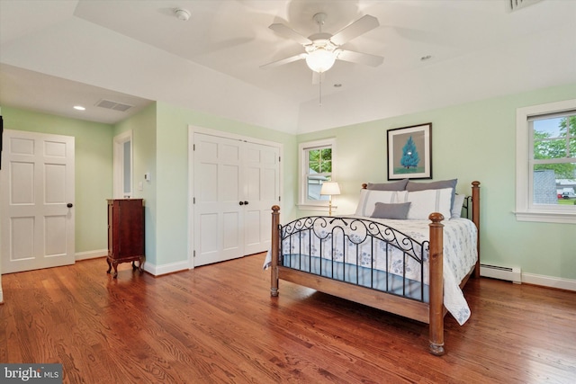 bedroom with wood finished floors, baseboards, a closet, and ceiling fan