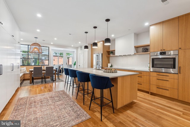 kitchen featuring oven, open shelves, modern cabinets, light countertops, and recessed lighting