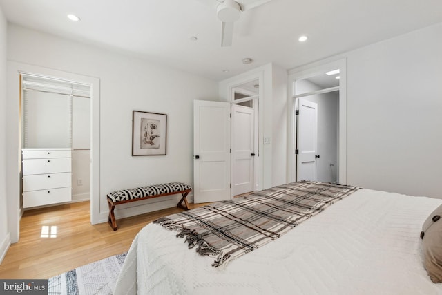 bedroom featuring light wood finished floors, recessed lighting, baseboards, and ceiling fan