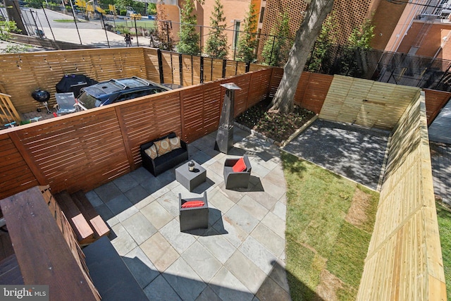 view of patio / terrace featuring fence