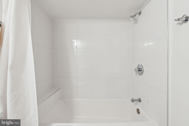 full bath featuring shower / bath combo with shower curtain