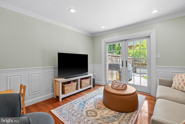 7029 Leewood Forest Dr, Springfield, VA 22151 - living room featuring wainscoting, ornamental molding, a decorative wall, wood finished floors, and french doors