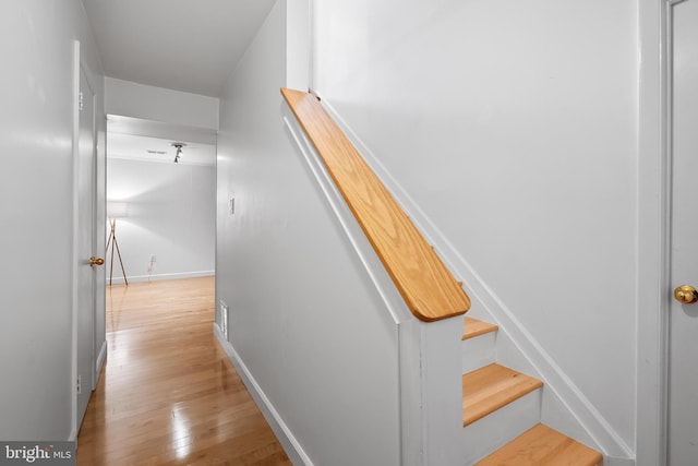 7029 Leewood Forest Dr, Springfield, VA 22151 - stairway featuring wood finished floors and baseboards