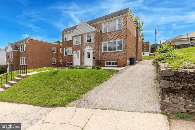 6920 Lawnton St, Philadelphia, PA 19128 - multi unit property with brick siding, a front yard, and asphalt driveway