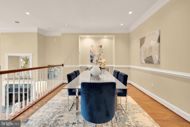 2221 N Oak Ct, Arlington, VA 22209 - dining area with wood finished floors, baseboards, recessed lighting, and crown molding