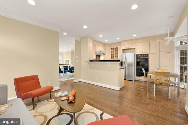 2221 N Oak Ct, Arlington, VA 22209 - living room with recessed lighting, light wood-type flooring, baseboards, and ornamental molding