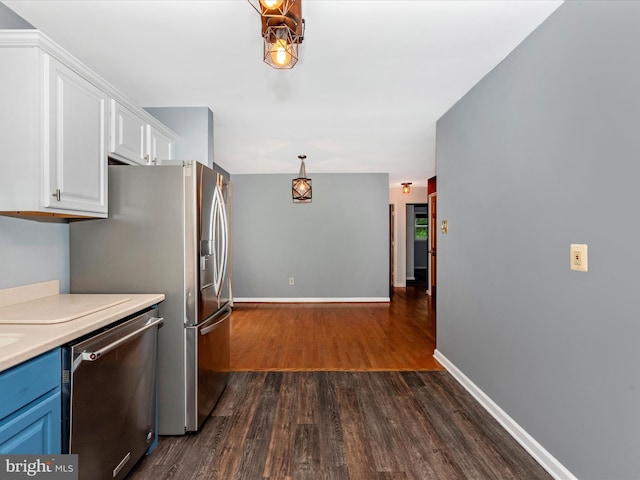 4106 Teklen Dr, Westminster, MD 21157 - kitchen with appliances with stainless steel finishes, dark wood-style flooring, white cabinets, and light countertops
