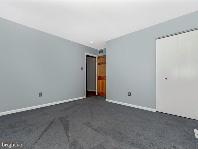 4106 Teklen Dr, Westminster, MD 21157 - unfurnished bedroom featuring dark carpet, a closet, and baseboards