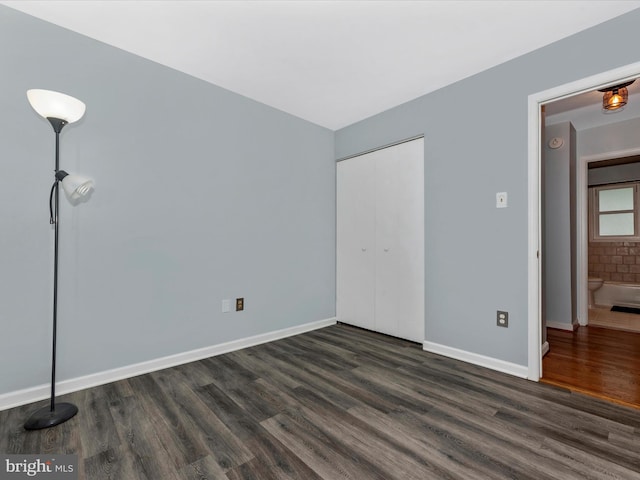 4106 Teklen Dr, Westminster, MD 21157 - unfurnished bedroom with dark wood-style flooring, baseboards, and a closet