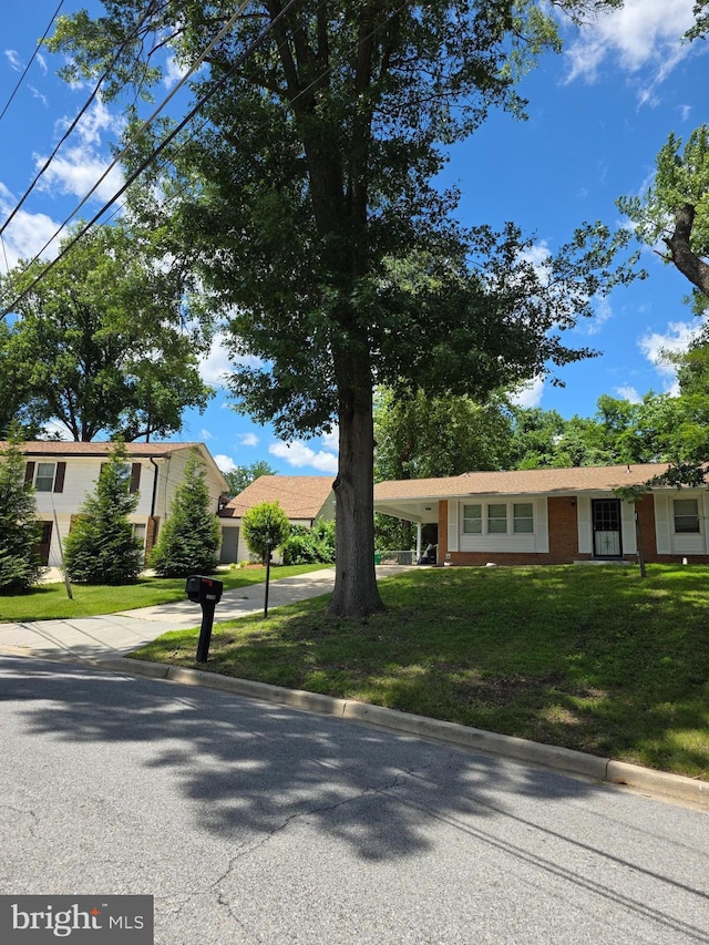 13103 Chalfont Ave, Fort Washington, MD 20744 - view of front of house featuring driveway, a front yard, and brick siding