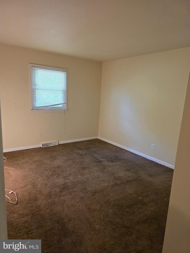 13103 Chalfont Ave, Fort Washington, MD 20744 - spare room with dark carpet and baseboards