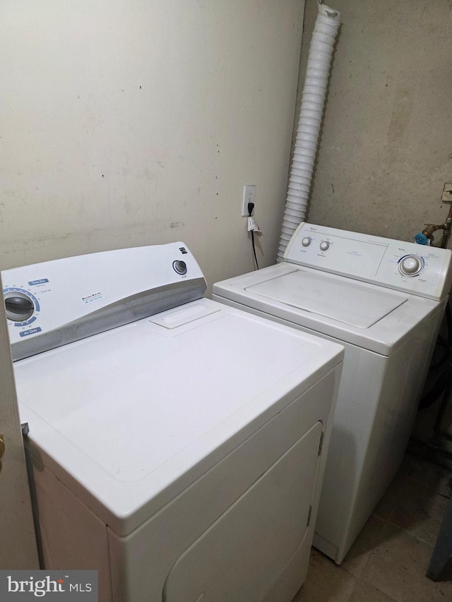 13103 Chalfont Ave, Fort Washington, MD 20744 - laundry room with separate washer and dryer and light tile patterned floors