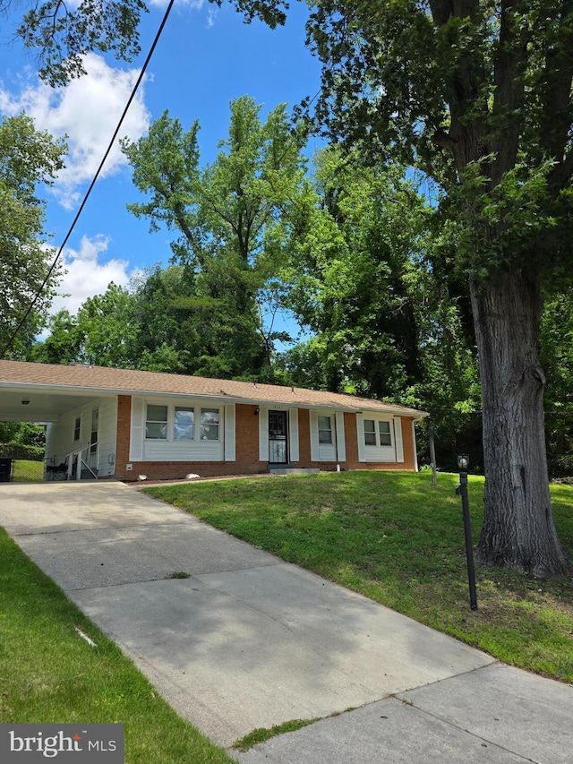 13103 Chalfont Ave, Fort Washington, MD 20744 - single story home featuring concrete driveway, brick siding, a front lawn, and an attached carport