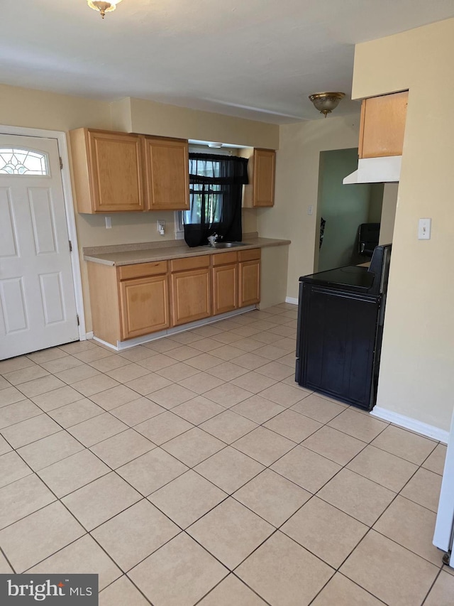 13103 Chalfont Ave, Fort Washington, MD 20744 - kitchen featuring light countertops, range, baseboards, under cabinet range hood, and light tile patterned flooring