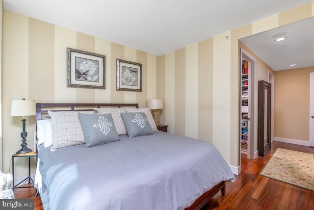 1414 S Penn Sq Unit 18H, Philadelphia, PA 19102 - bedroom featuring baseboards, wood finished floors, and wallpapered walls