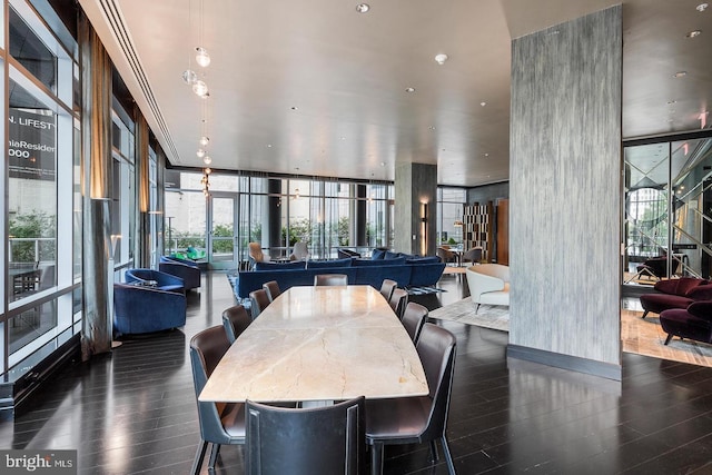 1414 S Penn Sq Unit 18H, Philadelphia, PA 19102 - dining space featuring a wall of windows and wood finished floors