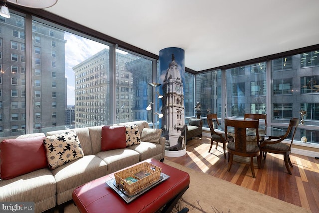 1414 S Penn Sq Unit 18H, Philadelphia, PA 19102 - living area with expansive windows, wood finished floors, and a view of city
