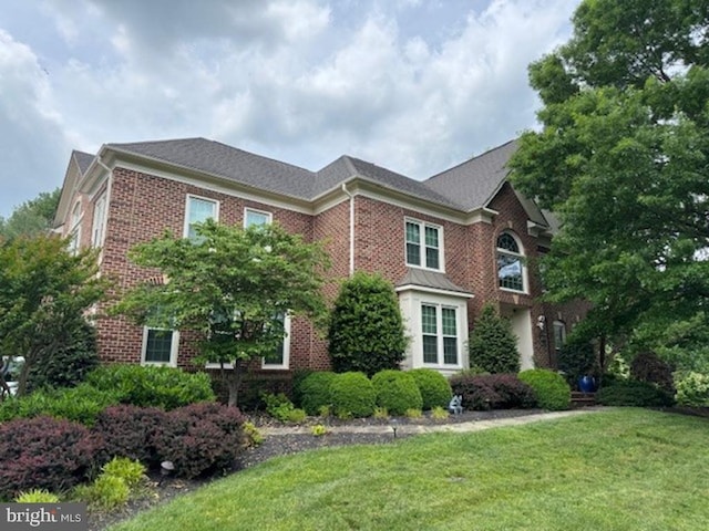 18309 Eldorado Way, Leesburg, VA 20176 - view of front facade featuring brick siding and a front yard