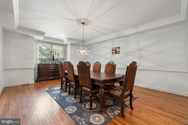 18309 Eldorado Way, Leesburg, VA 20176 - dining area featuring hardwood / wood-style floors, a chandelier, ornamental molding, baseboards, and a raised ceiling